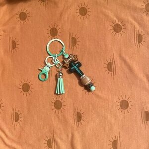 Teal cross football Keychain with Tassel